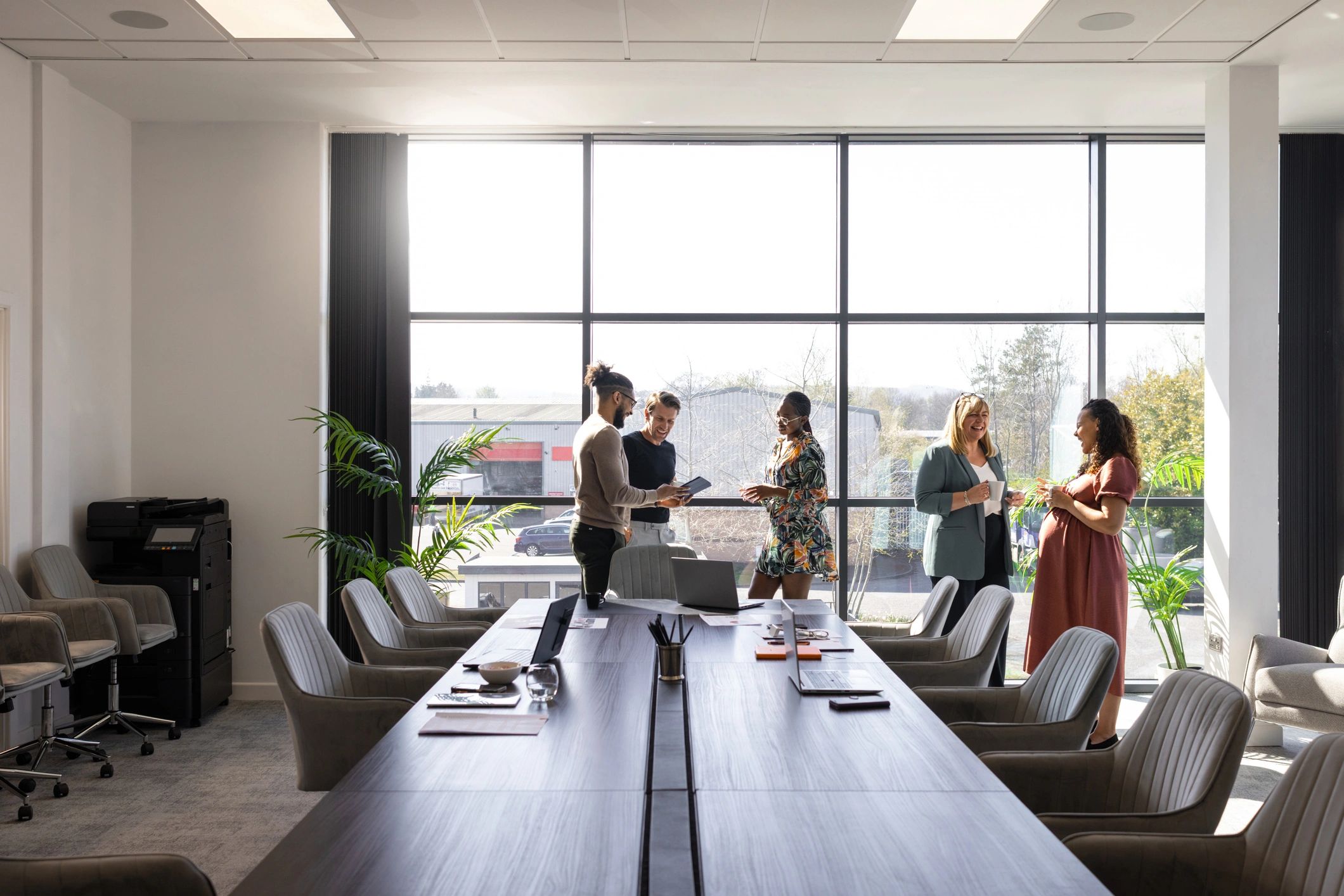 Digadop AI team collaborating in a modern office