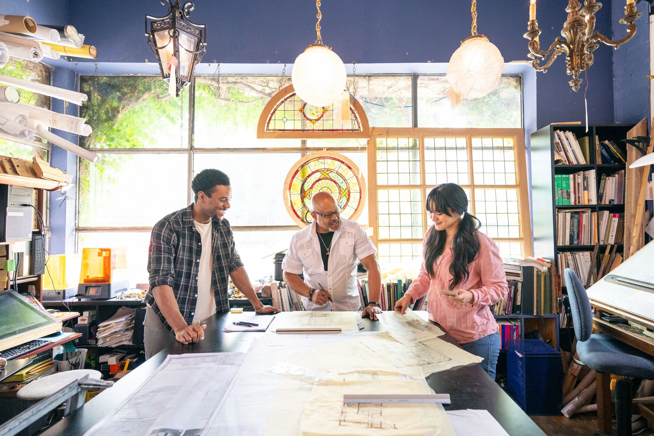 Team collaborating in a studio environment representing AI assistance and workflow support